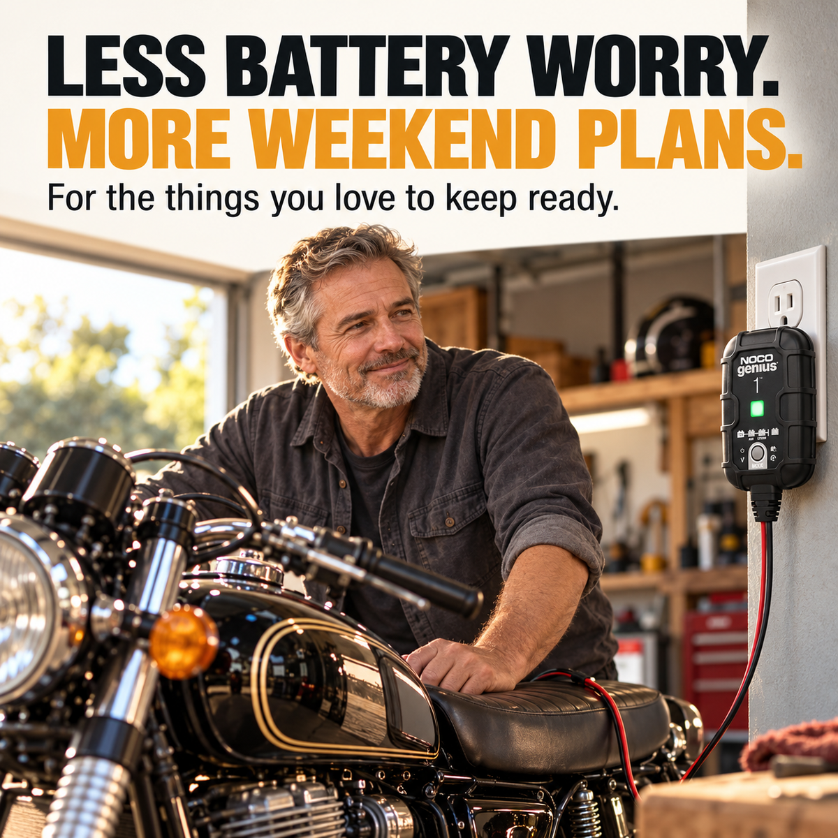 Motorcycle owner with GENIUS1 battery maintainer in a garage